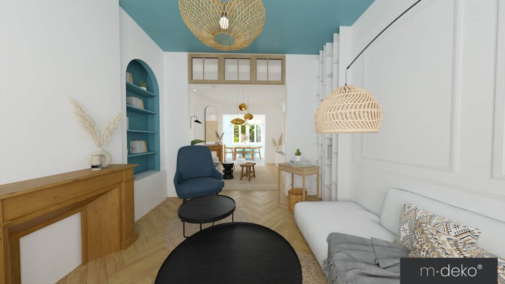 Salon lumineux moderne avec canapé gris, fauteuil bleu, suspensions en rotin et décoration blanche épurée
